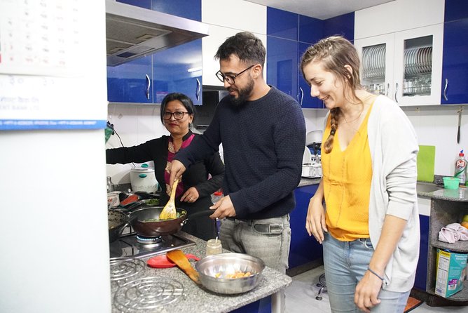 Cook and Dine with a Local family - Choosing vegetables and spices at a local market