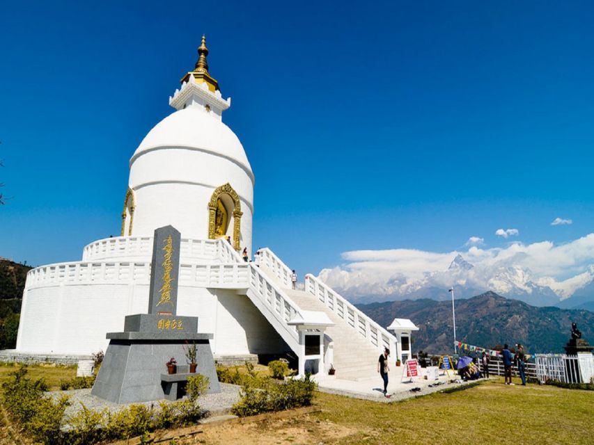 From Pokhara: Guided Day Jungle Hiking Tour with Boat Ride - Walking up to the World Peace Pagoda