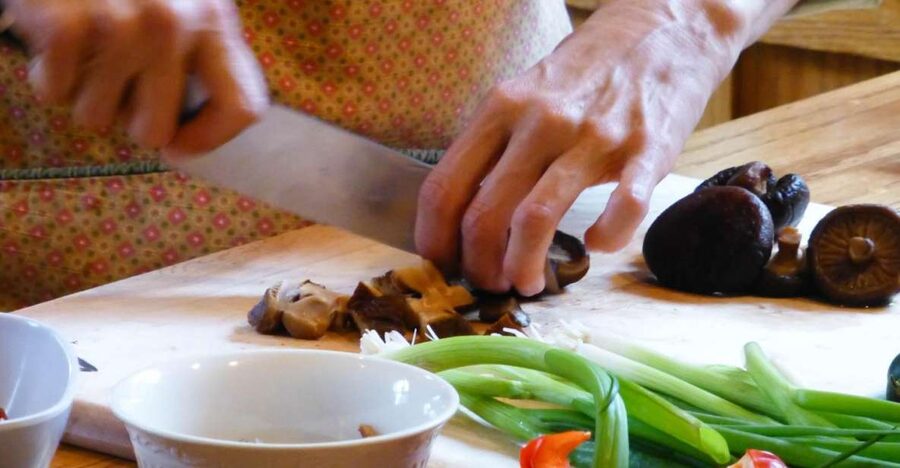 MoMo or Dal Bhat Cooking Class at Aama Kitchen in Pokhara - Cooking, asking questions, and eating together