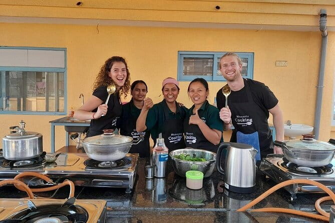 Traditional Nepali Momo Making Classes - Rolling dough, filling wrappers, and folding momos